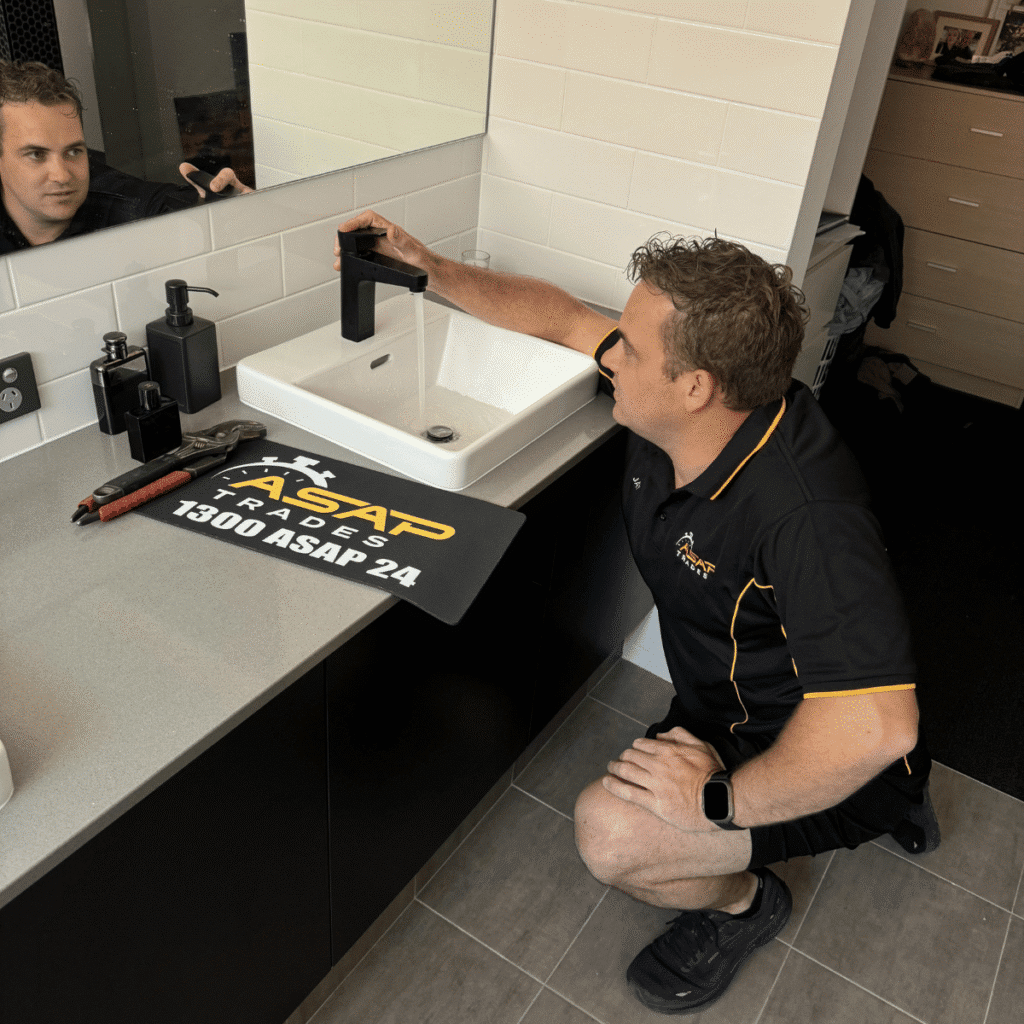 One of the owners of asap trades working on a tap fitting in Perth